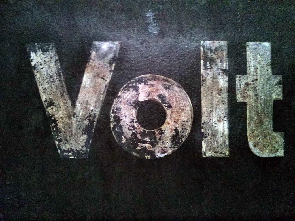 grungy metal letters spelling out volt